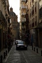 Vertical shot of a street in Granada with the Iglesia de los Santos Justo y Pastor basilisk