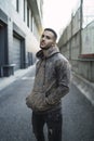 Vertical shot of a stylish young man wearing a hoodie and jeans Royalty Free Stock Photo