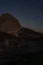 Vertical shot of the sunset on Mount Mangart, on the border between Italy and Slovenia