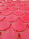 Vertical shot of a surface with red plastic patterned tiles