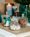 Vertical shot of sweets candle and a vase on a Christmas table