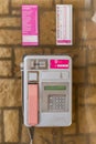 Vertical shot of the T-Mobile company brand public telephone in the city center of Pula, Croatia