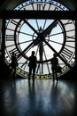 Vertical shot of t people standing inside a clock tower in Paris, France Royalty Free Stock Photo