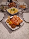 Vertical shot of a table full of food and tableware Royalty Free Stock Photo