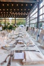 Vertical shot of a table setting at the wedding venue with a blurred background Royalty Free Stock Photo