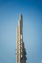 Vertical shot of the tall building with bells on the side with clear sky in the background