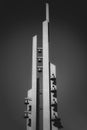 Vertical shot of the tall building with bells on the side with clear sky in the background