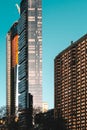 Vertical shot of tall modern architectural buildings with clear sky in the background