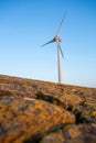 Vertical shot of tall wind-turbines along the Westermeerdijk in the Netherlands