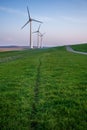 Vertical shot of tall wind-turbines along the Westermeerdijk in the Netherlands