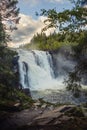 Vertical shot of the Tannforsen waterfall in Sweden