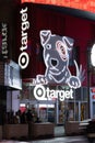 Vertical shot of a Target shop in Times Square with a bright white bulldog neon sign
