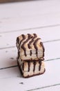 Vertical shot of tasty biscuits with chocolate on top on a white background Royalty Free Stock Photo