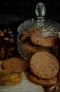 Vertical shot of tasty cookies in a jar in an autumn decoration set Royalty Free Stock Photo