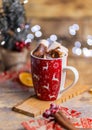 Vertical shot of tasty hot chocolate with marshmallows in a red Christmas cup Royalty Free Stock Photo