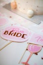 Vertical shot of team bride signs in pink color