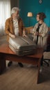 Vertical shot of a teenager, young man packing his belongings in a suitcase. His grandfather, granddad is helping him