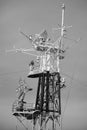 Vertical shot of a television antenna in grayscale