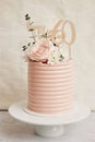 Vertical shot of a 60th birthday cake with beautiful rose decorations