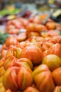 Vertical shot of tomate Valenciano, in the central market of Valencia, Spain