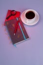 Vertical shot top view coffee cup with pen and copybook. Royalty Free Stock Photo