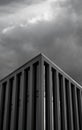 Vertical shot of the Torre Picasso under the clouds in Madrid, Spain in grayscale Royalty Free Stock Photo