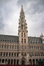 Vertical shot of Town Hall on the Grand Place in Brussels, Belgium with a cloudy gray sky Royalty Free Stock Photo