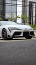 Vertical shot of a Toyota Supra MKV A90 Front end on public parking