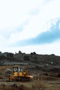 Vertical shot of tractor on the hill in Paphos district under blue sky