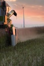 Vertical shot of a tractor reaping the wheat fields Royalty Free Stock Photo