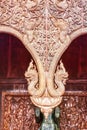 Vertical shot of traditional carved wooden interior of Wat Pahuaylad