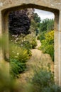 Vertical shot of a trail in beautiful green Rousham Gardens in England