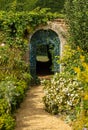 Vertical shot of a trail in beautiful green Rousham Gardens in England