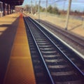 Vertical shot of a train track during daytime Royalty Free Stock Photo