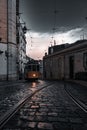 Vertical shot of a tram through the streets of Lisbon on a cloudy day