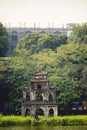 Vertical shot of the turtle tower located on an island in Hoan Kiem lake in Vietnam Royalty Free Stock Photo