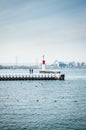 Vertical shot of two people on the Burlington Lift Bridge in the daylight in Canada