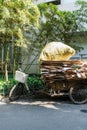 Vertical shot of a typical garbage collector bike full of cardboard in Shanghai, China