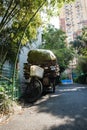 Vertical shot of a typical garbage collector bike full of cardboard in Shanghai, China