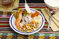 Delicious traditional Peruvian ceviche plated with beer. Royalty Free Stock Photo