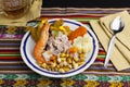 Delicious traditional Peruvian ceviche plated with beer. Royalty Free Stock Photo