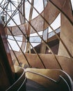 Vertical shot of a unique design of a building with a staircase