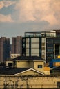 Vertical shot of urban buildings in Deyang, China at sunset