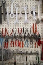 Vertical shot of a variety of tools in a bike shop