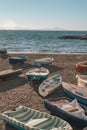 Vertical shot of various colorful Boats on the beach of the Amalfi Coast