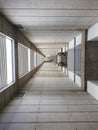 Vertical shot of a very long empty hallway with bicycle tires sticking out on one side Royalty Free Stock Photo