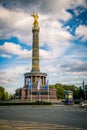 Vertical shot of the Victory Column Monument in Berlin against blue cloudy sky