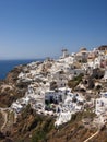 A vertical shot of the village of Oia in Santorini Greece