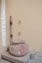 Vertical shot of a vintage clay pot on a palet