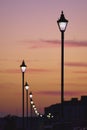 Vertical shot of vintage street lights with purplish sunset in the background in Ramsgate, UK